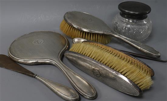 A George V silver-mounted dressing table set,